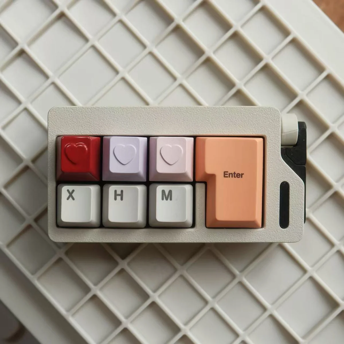 Premium handcrafted aluminum ESC keycap. A vibrant heart motif with a polished metallic finish, displayed from multiple artistic angles.