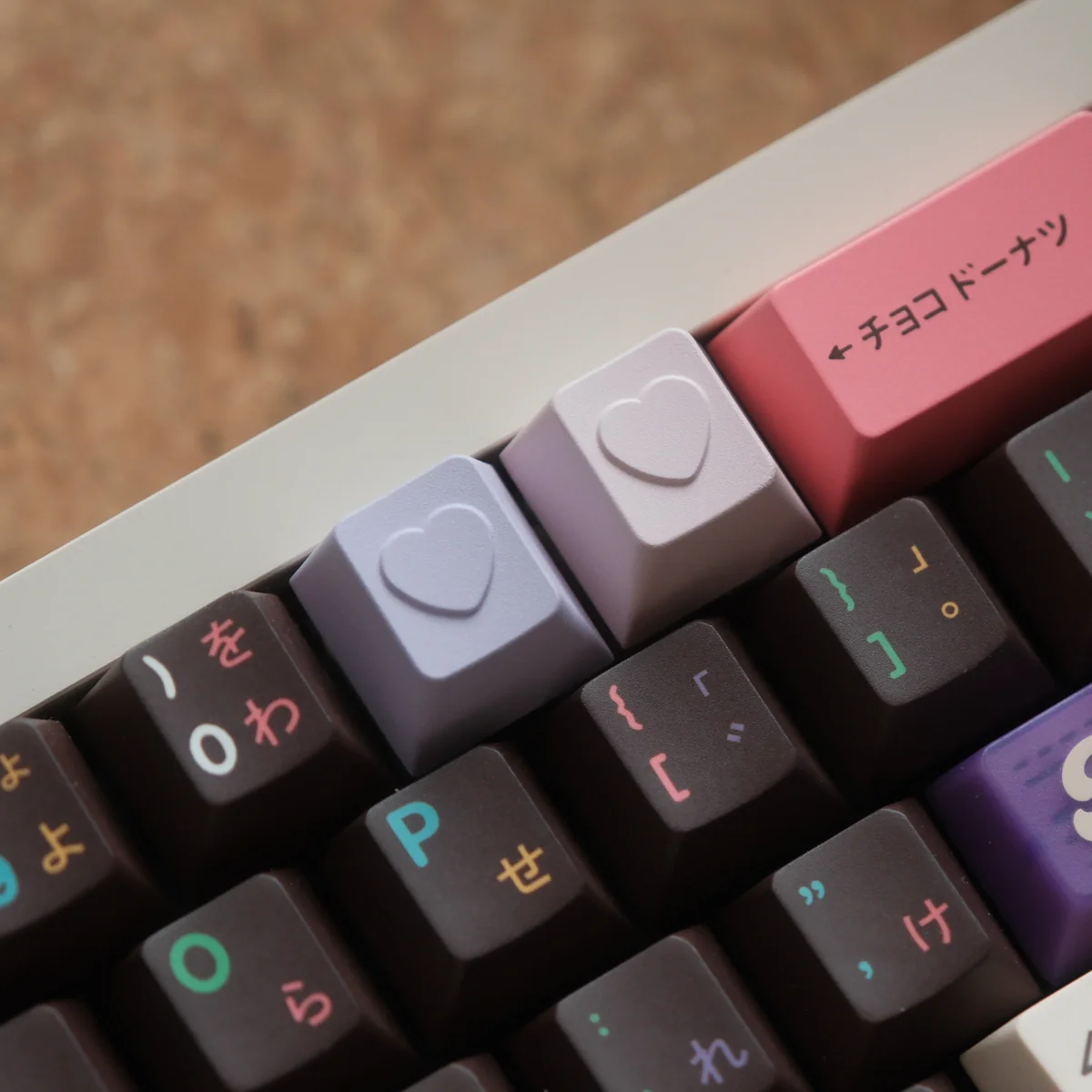 Close-up of a handcrafted premium aluminum ESC keycap featuring a romantic polished heart design from multiple angles, showcasing its vibrant angles.