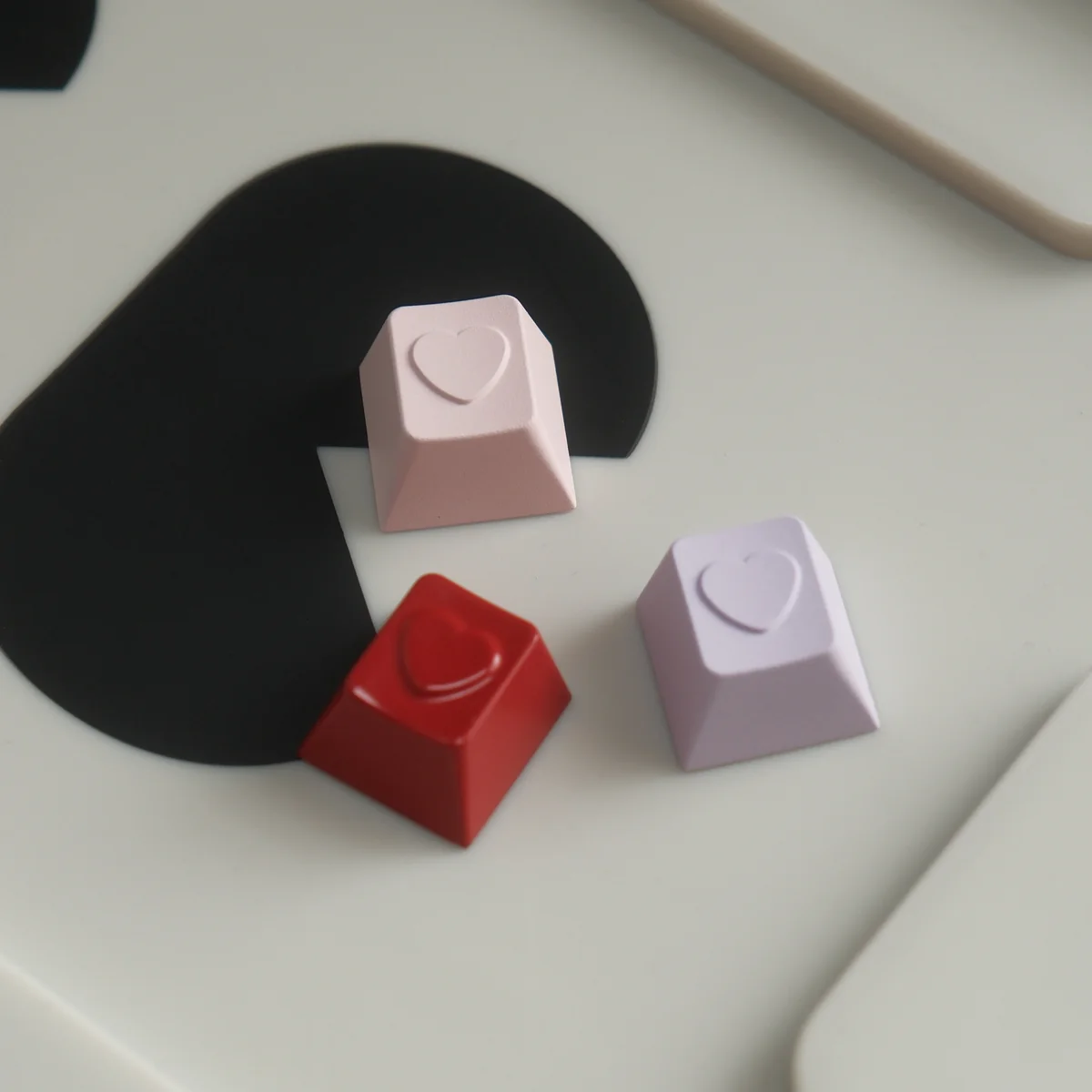 Handcrafted premium aluminum ESC keycap with a romantic polished heart, shown from various angles to highlight its artistic design and vibrant angles.