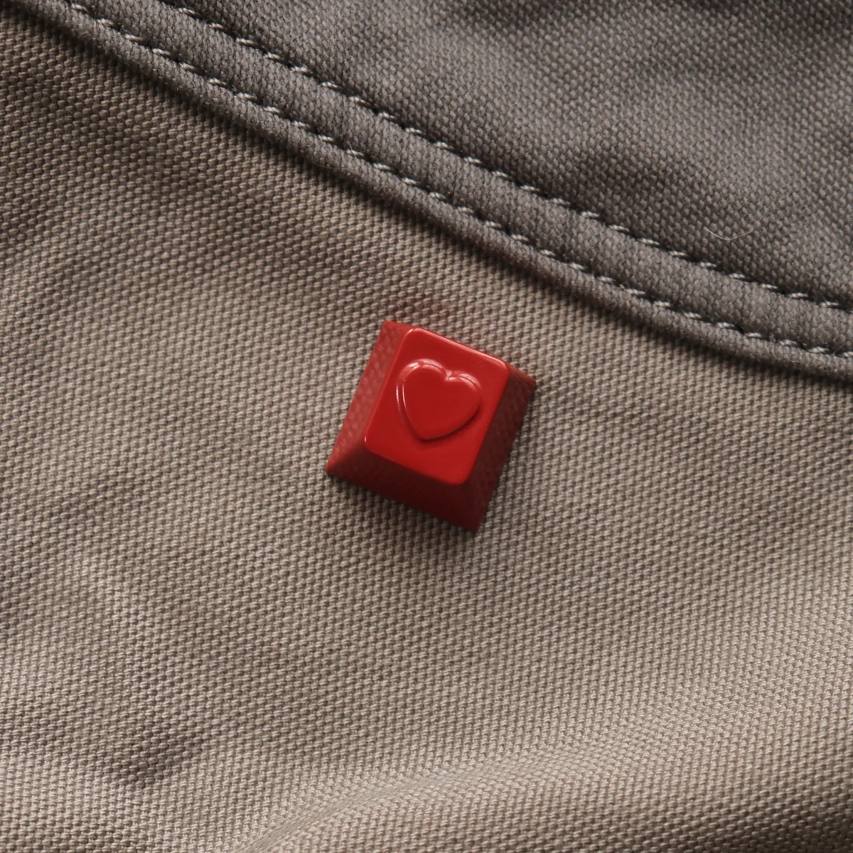 Premium handcrafted crimson red heart ESC keycap, highlighting its polished aluminum finish and romantic, artistic design for a unique keyboard.
