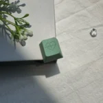 Close-up views of the limited edition green heart aluminum R4 keycap, showcasing its elegant design, premium craftsmanship, and romantic heart accent.