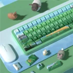 Close-up of the distinctive Heidi-themed PBT dye-sublimated keycap set, showing serene Alpine landscapes and storybook illustrations.