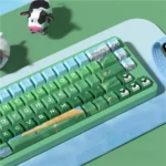 Heidi's Alpine Adventures PBT dye-sublimated keycap set shown from various angles. Features serene Alpine landscapes and heartwarming storybook art.