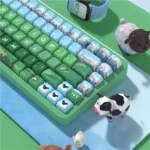 Heidi full keycap set, PBT dye-sublimated. Gallery view, unique angle, shows serene Alpine landscapes and artistic storybook art.