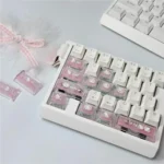 Detailed shot of a handcrafted Hello Kitty Cherry profile accent keycap, highlighting its iconic pink and white design and premium, whimsical charm.