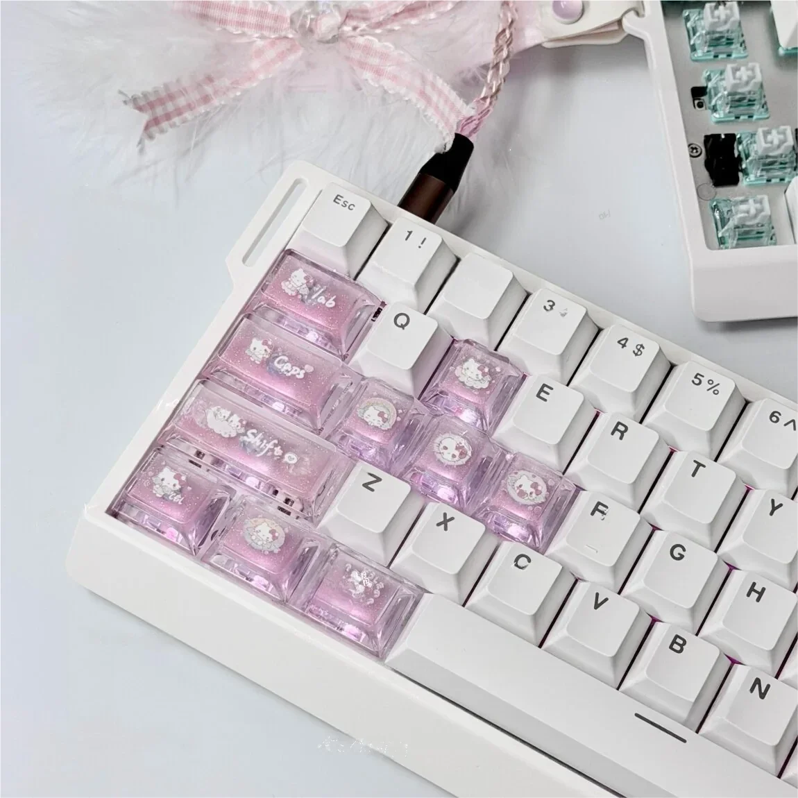 Vibrant handcrafted Hello Kitty keycaps set, showcasing iconic pink and white characters. These charming, premium accent keycaps are handmade for unique.