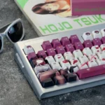 An exclusive Honkai Star Rail Kafka PBT dye-sub keycap set, elegantly displaying its dark, mysterious character art and intricate symbols from a unique design.