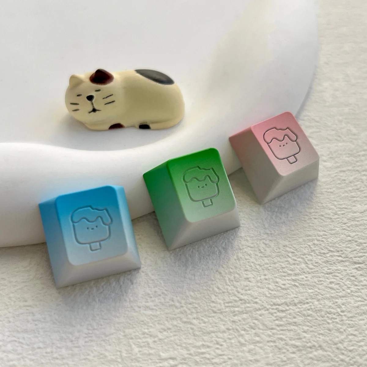 Whimsical handcrafted aluminum ice cream keycap, displaying vibrant colors and a polished metallic finish, highlighting its artisan craftsmanship.