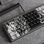 Multiple views of the Berserk side-lit PBT keycaps set, revealing gritty dark fantasy details, premium craftsmanship, and subtle backlit legends.