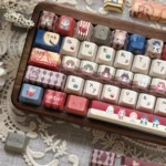 Close-up of the exclusive Identity V Gothic Mystery PBT Cherry keycap set, showcasing intricate character art and dark mysterious iconography from various angles.