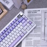 Artistic Iris PBT keycaps set: a gallery showing dye-sublimated ethereal iris flower motifs, backlit glow, and elegant Cherry profile from diverse angles.