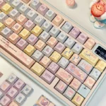 Gallery of vibrant, translucent Jellyfish PBT keycaps set for mechanical keyboards, showcasing ethereal pink and purple bioluminescent designs.
