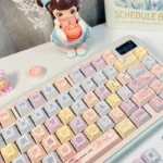 Multiple views of the vibrant, translucent Jellyfish PBT keycap set, showing pink and purple bioluminescence and dynamic patterns for ocean lovers.