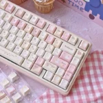 Whimsical Karami PBT dye-sub keycaps set gallery showcasing unique character designs and soft hues. A delightful, artistic keyboard upgrade.