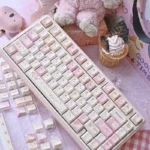 Whimsical Karami PBT dye-sub keycaps set featuring unique character designs and soft, delightful hues, perfect for a playful keyboard aesthetic.
