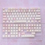 Whimsical Karami PBT Dye-sub Keycaps set, uniquely showcasing playful character designs and soft hues from a fresh, artistic angle.