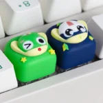 Close-up of a vibrant, handcrafted Keroro Gunso anime resin keycap, showcasing its intricate details and playful character design from a unique angle.