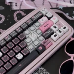 Adorable black and pink Lace Cat PBT MAO keycap set, featuring delicate lace patterns and durable dye-sub finish for mechanical keyboards.