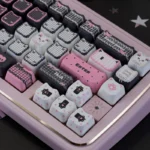 Adorable Lace Cat PBT MAO keycap set for mechanical keyboards, displaying its durable dye-sub black and pink lace design from many charming angles.