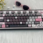 Close-up views of the adorable black and pink Lace Cat PBT MAO keycap set, showcasing its charming design and durable dye-sublimated details for mechanical keyboard.