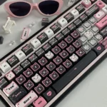 Adorable pink and black lace cat PBT MAO keycap set, featuring a charming front-printed design for mechanical keyboards. Durable dye-sub ensures lasting.