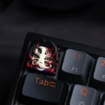 Exclusive Kokushibo artisan keycap for keyboards, shown from various angles. Its dark, intricate Demon Slayer design is menacing and character-acerated design.