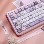 Close-up of the exclusive Kuromi's Diary PBT Dye-Sub Keycap Set, showing playful purple illustrations. Mischievous fun.