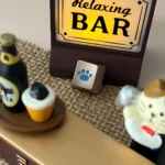 Close-up views of the whimsical lake blue cat paw keycap, showcasing its premium CNC aluminum craftsmanship and charming R4 design from various angle.