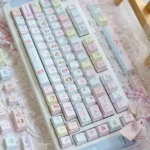 Close-up of the charming 'Little Girl' PBT keycaps set, showcasing the whimsical artistry and innocent design from a unique angle, perfect for customization.