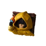 Detailed close-up of a handcrafted Little Nightmares Six resin ESC keycap, showcasing its eerie, artistic design from multiple angles, emphasizing art.