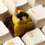 Detailed side view of the handcrafted Little Nightmares Six resin ESC keycap, capturing its dark, mysterious aesthetic and intricate artistic craftsmanship.