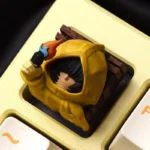 An artistic, detailed view of the handcrafted Little Nightmares Six resin ESC keycap, highlighting its dark, mysterious aesthetic and intricate design.