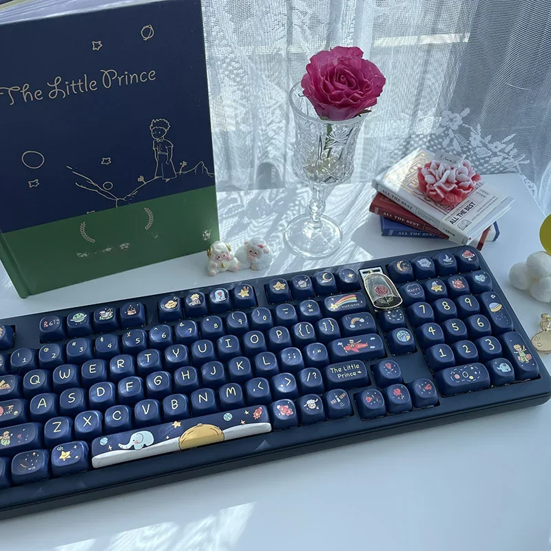 Enchanting Little Prince PBT Dye-Sub Keycap Set, showcasing whimsical journey themes, delicate pollen motifs, and soft, dreamy hues. An artistic keyboard.