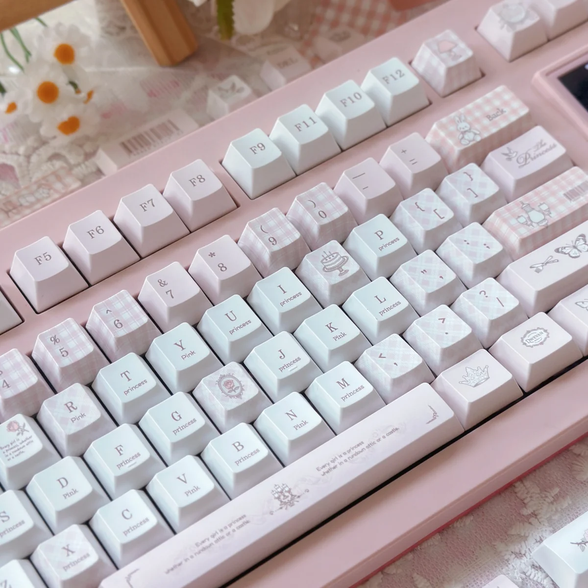 A romantic Love Alarm PBT Dye-sub keycap set, viewed from an artistic angle, highlighting soft colors and exclusive iconic motifs for a playful keyboard.