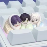 This Love Deepspace resin artisan keycap features an intricate cozy bed scene sculpture, captured from a captivating angle for dedicated fans.