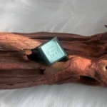 Artistic precision CNC Maltese Dog Keycap, featuring minimalist line-art of a Maltese, shown from various angles. An elegant setup.