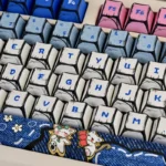 A collection of whimsical Manga Cowboy Cat PBT keycaps set, showcasing vibrant, playful feline adventurer designs from various angles, perfect for customization.