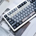 Exquisite Medieval Astrolabe Dye-Sub PBT keycap set, displaying intricate celestial maps and ancient astronomical instruments from an artistic perspective view.