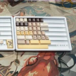 Whimsical Meow Cafe PBT Keycap Set showcased from various angles. Vibrant dye-sub feline designs, premium PBT, and adorable cat motifs for a playful keyboard.