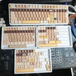 Whimsical Meow Cafe PBT Keycap Set gallery showcasing premium dye-sub PBT keycaps from multiple angles, highlighting adorable feline designs and vibrant design.