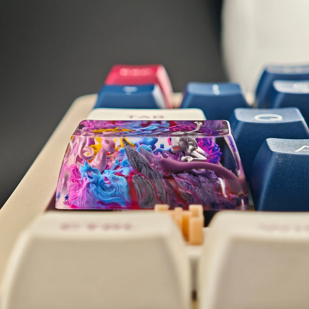 Main handcrafted Mewtwo Mew resin keycap, an artistic collectible capturing dynamic Mewtwo vs. Mew with vibrant psychic energy.