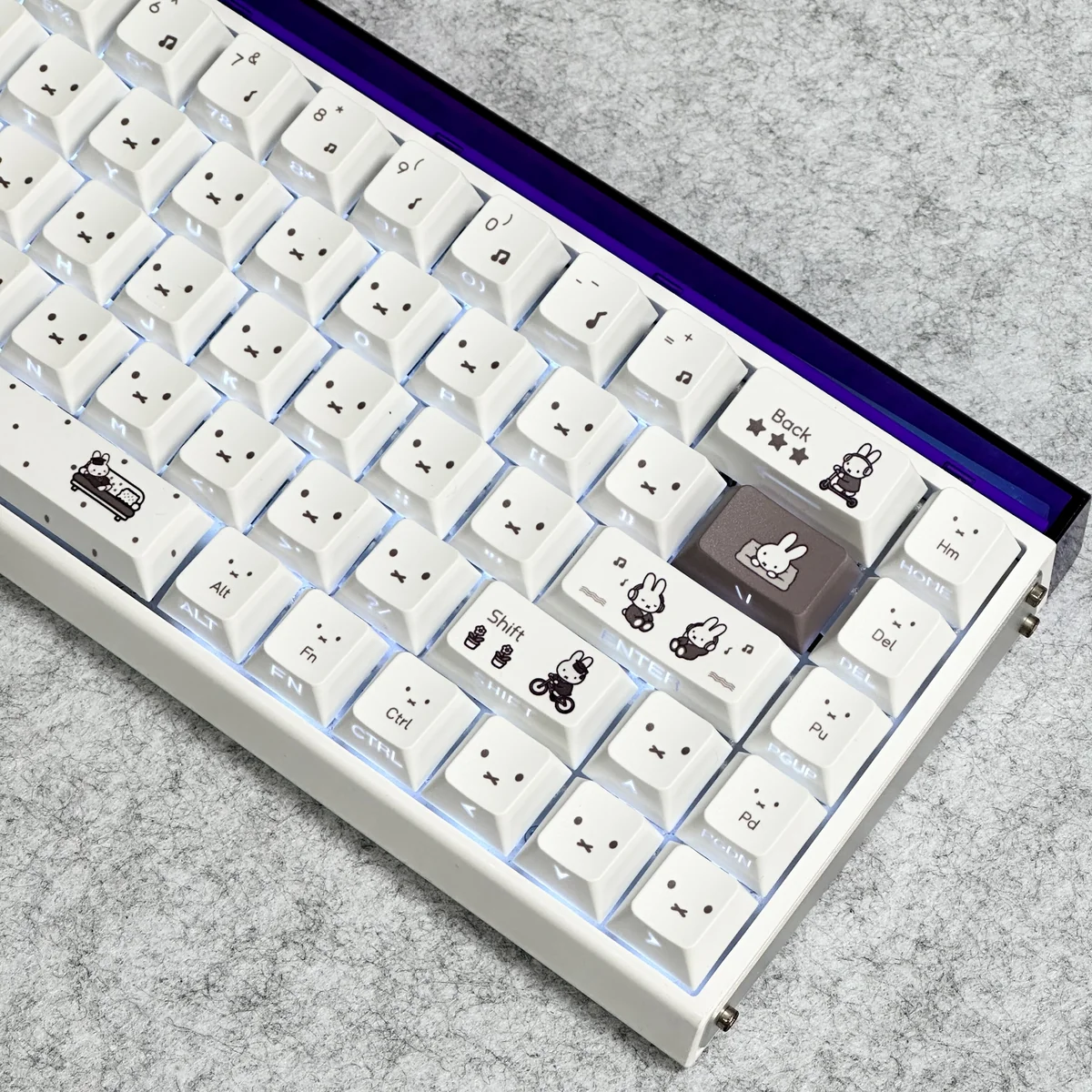 Miffy PBT keycaps set, translucent side-printed with whimsical Miffy designs. Glowing legends and durable PBT texture shown from various angles.