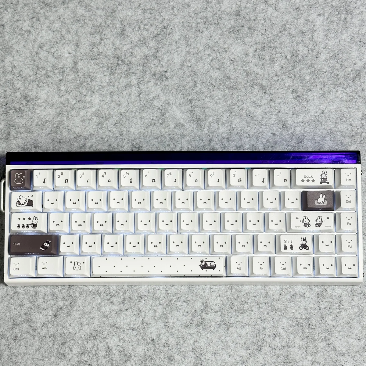 A vibrant main display of Miffy PBT keycaps set, featuring translucent side-printed Miffy legends for a playful, glowing keyboard aesthetic.