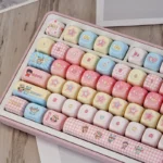 Exclusive Mirmo! PBT dye-sub anime keycap set, showcasing vibrant whimsical characters and magical motifs from a playful, detailed angle.