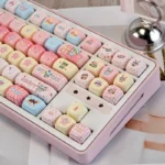 Detailed view of the whimsical Mirmo! anime PBT dye-sub keycap set, showcasing vibrant characters and magical motifs on durable PBT.