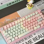 Whimsical Pink Gradient Melon MOA PBT Keycap Set displayed, showcasing its delightful soft pink to white pastel transition, perfect for a cute keyboard aesthetics.