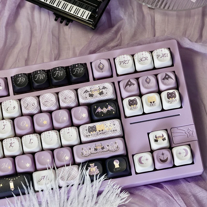 Star Weaver Witch MOA PBT keycaps set displaying their unique mystical celestial patterns and witchy fantasy elements from multiple captivating perspective view.