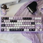 A close-up of the unique Star Weaver Witch MOA PBT Keycaps set, featuring mystical celestial and witchy fantasy designs for a captivating keyboard.