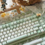 Tranquil Moss Whisper PBT Dye-sub keycaps set in serene moss-green and earthy tones, creating a tranquil nature desktop.