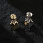 Detailed profile view of the handcrafted mummy keycap, revealing its intricate ancient Egyptian artifact sculpting and artisanal metalwork.